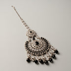Onyx Pearl Tikka detail showing black oval borders and pearl-cluster fringe along crescent base
