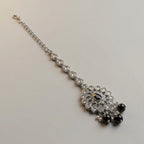 Sia Noir Tikka detail showing crystal mandala pendant, black teardrop center, and pearl-trimmed bead fringe