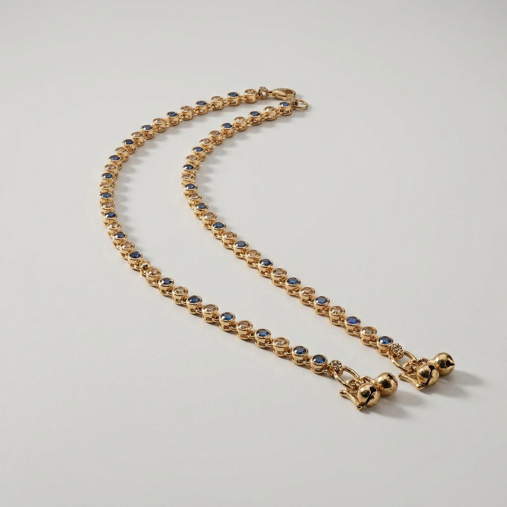 Midnight Glimmer Anklet pair of gold-tone blue and clear stone payals with bells