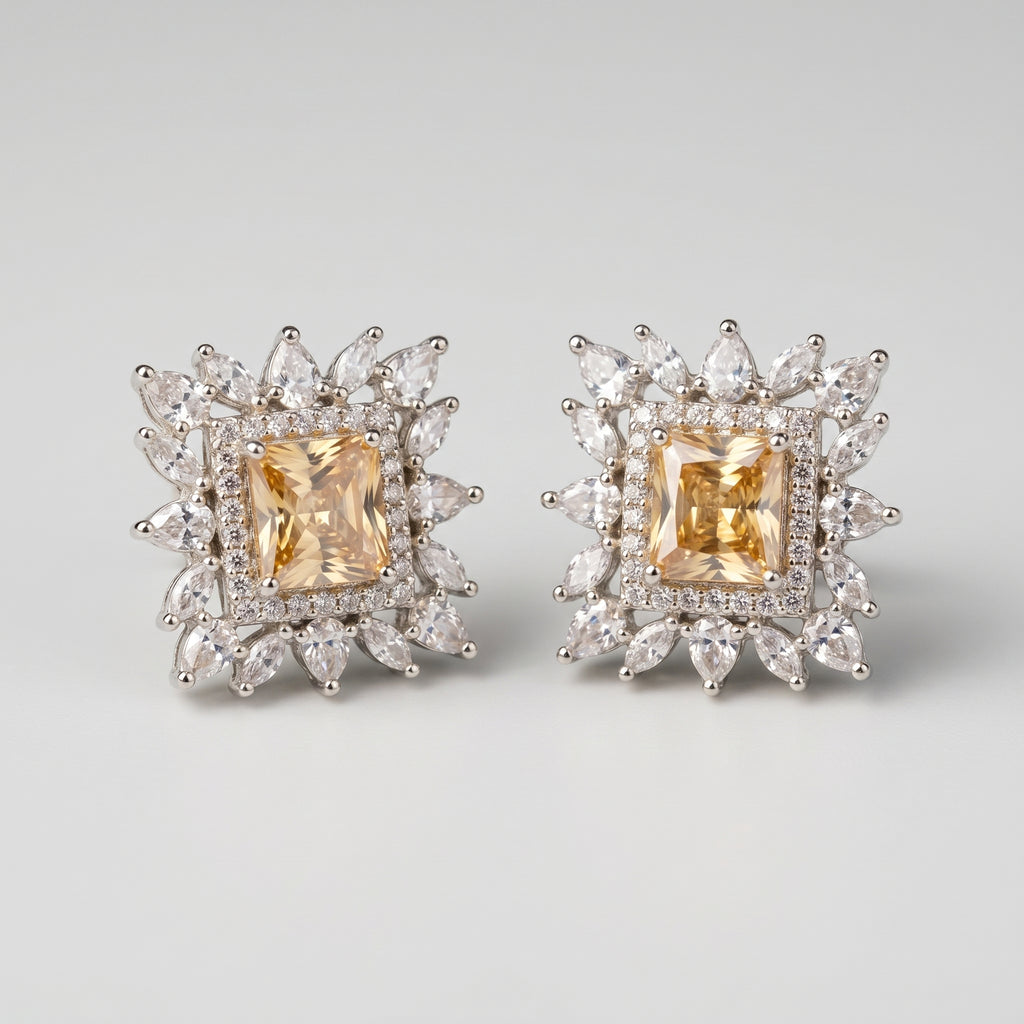 Citrine Square Earrings detail showing yellow emerald-cut center crystal halo and pear sunburst border