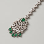 Sia Emerald Tikka detail showing emerald center stone and five green teardrop fringe drops