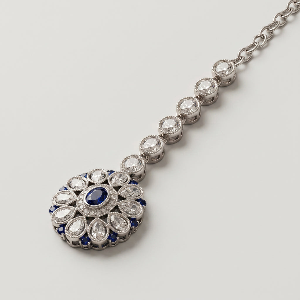 Nilam Bloom Tikka detail showing blue center stone and pear-shaped crystal petals