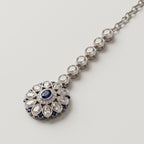 Nilam Bloom Tikka detail showing blue center stone and pear-shaped crystal petals