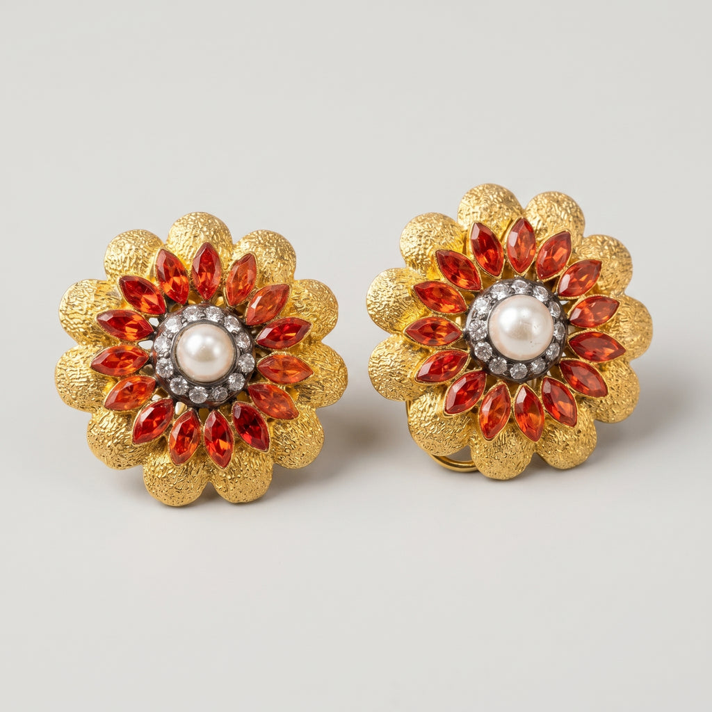 Manik Bloom Earrings detail showing crystal halo orange-red stones and hammered gold petals