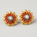 Manik Bloom Earrings detail showing crystal halo orange-red stones and hammered gold petals