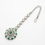 Emerald Axis Tikka detail showing oval emerald center and teardrop crystal petals