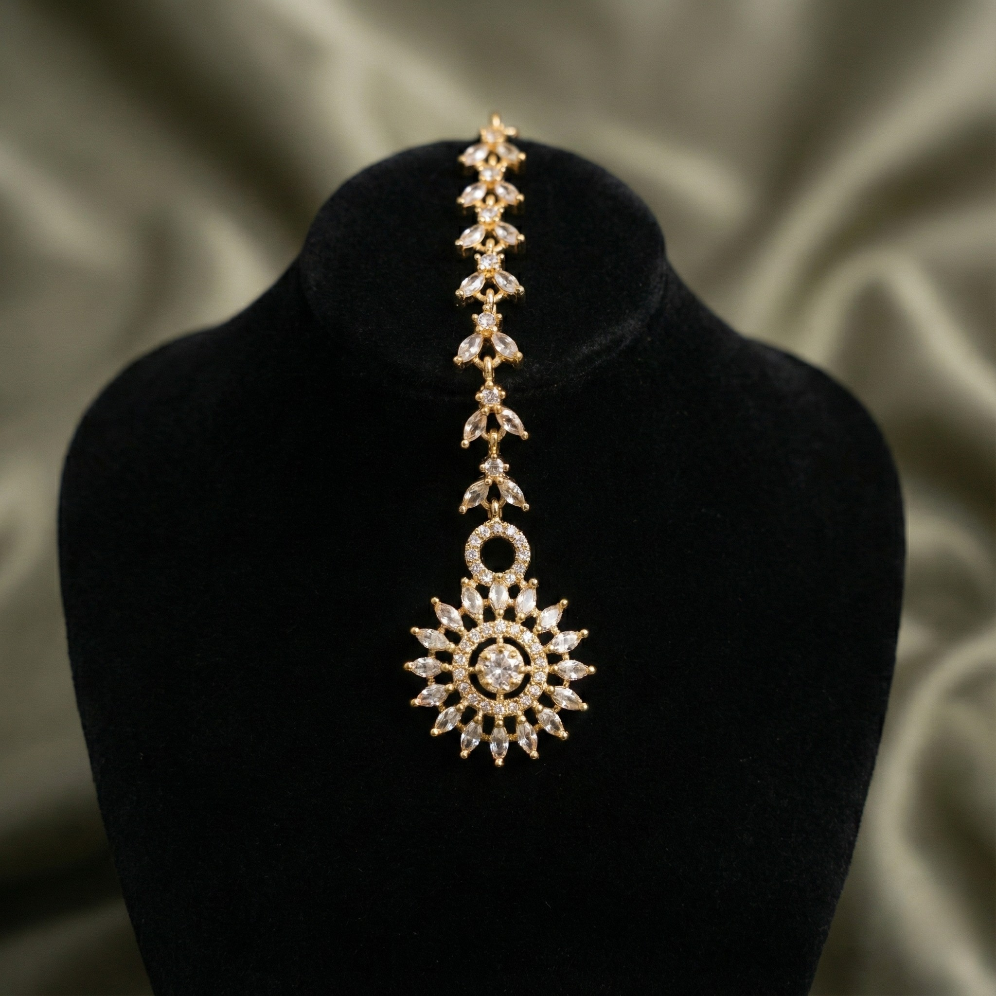 Solar Line Tikka close-up of marquise chevron links and radiating sunburst clear stones