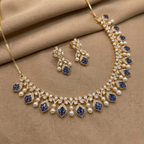 Close-up flatlay of Azure Pearl Glow Statement Set necklace and matching earrings