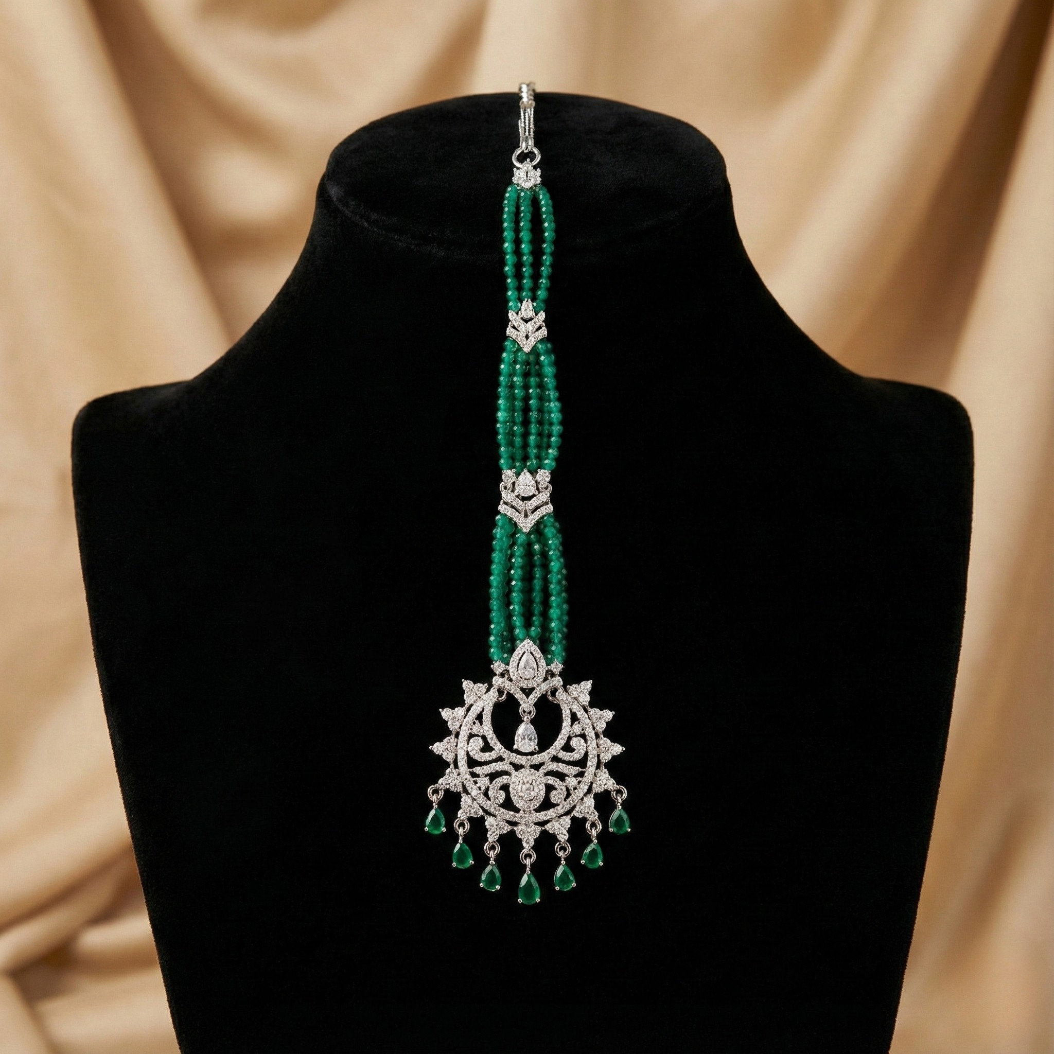 Verdant Noor Tikka detail showing green bead rows and pavé sunburst medallion