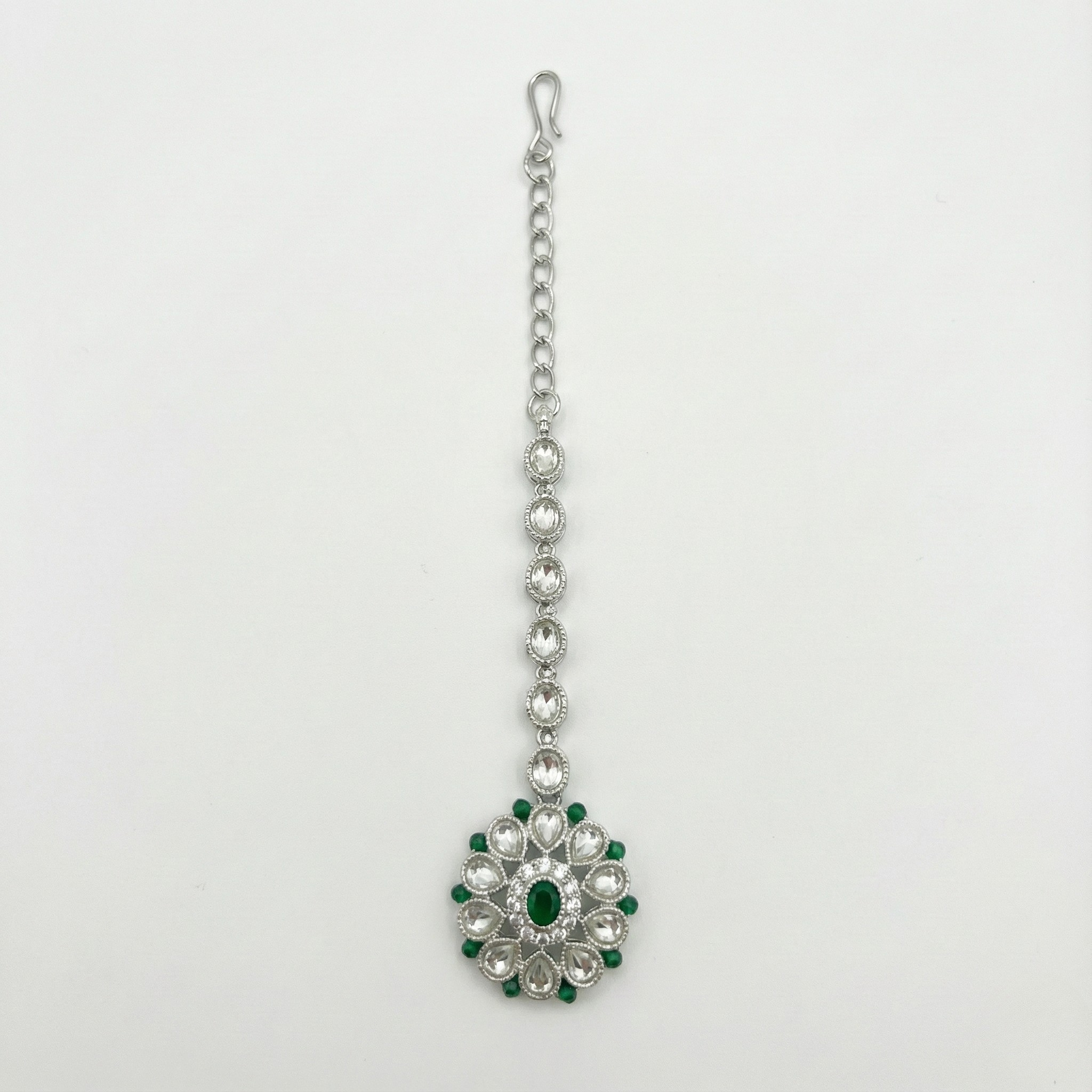 Emerald Axis Tikka silver floral maang tikka with emerald center and clear petal halo