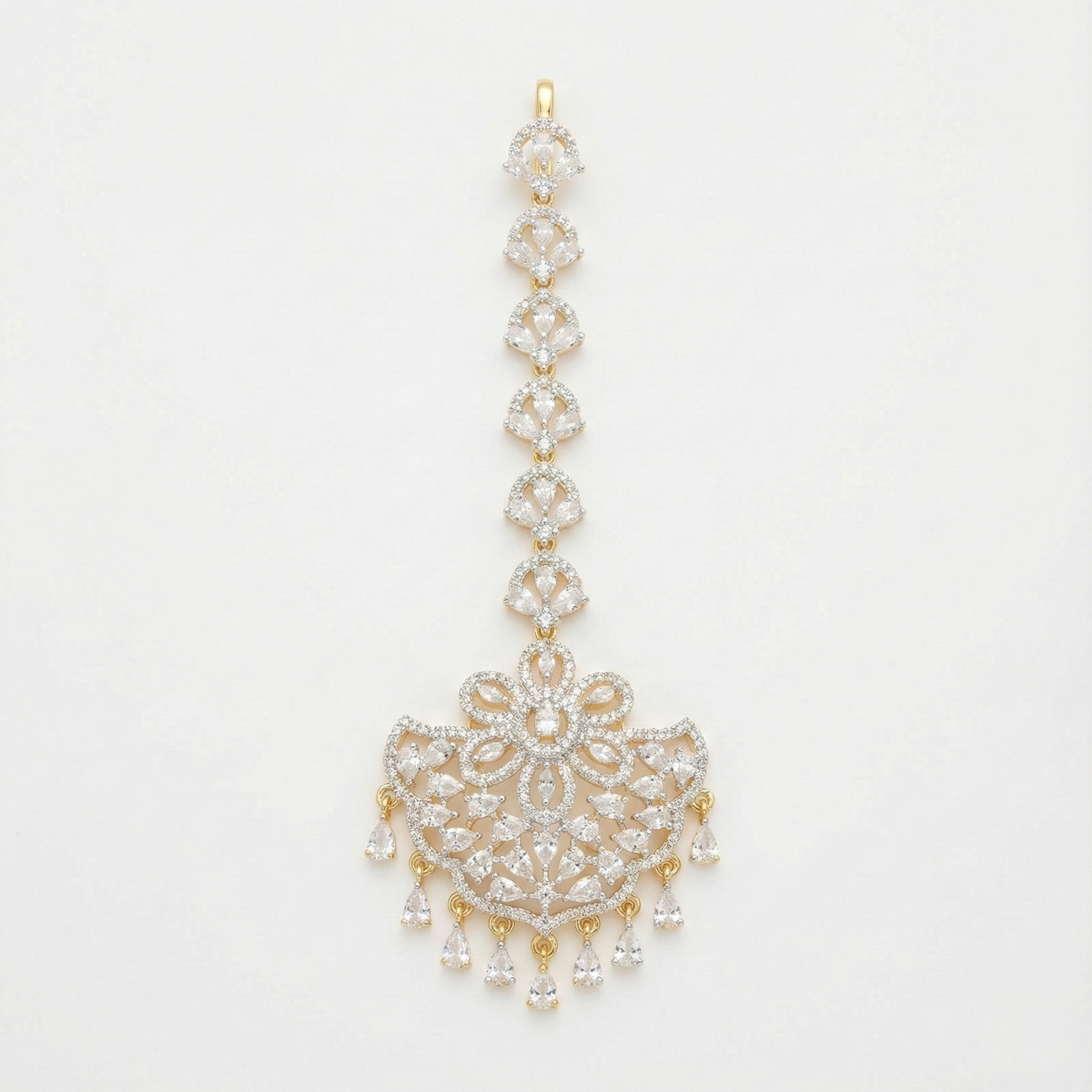 Crescent Lace Tikka gold-tone fan-shaped maang tikka with floral clear-stone center on gray background