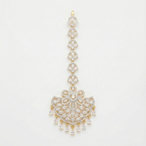 Crescent Lace Tikka gold-tone fan-shaped maang tikka with floral clear-stone center on gray background